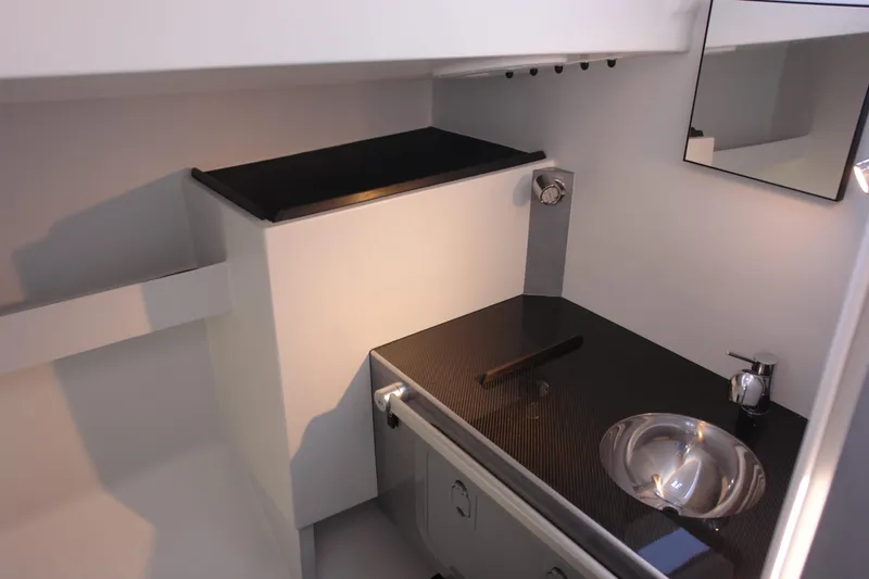 Slide: The Image of Modern Black Pepper Code 2 yacht bathroom with sleek sink and mirror, 2025 model. - 12