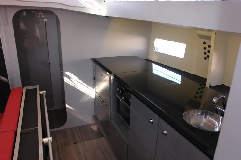 Slide: The Image of Modern yacht interior with sleek kitchen, Black Pepper Code 2, 2025 model. - 13