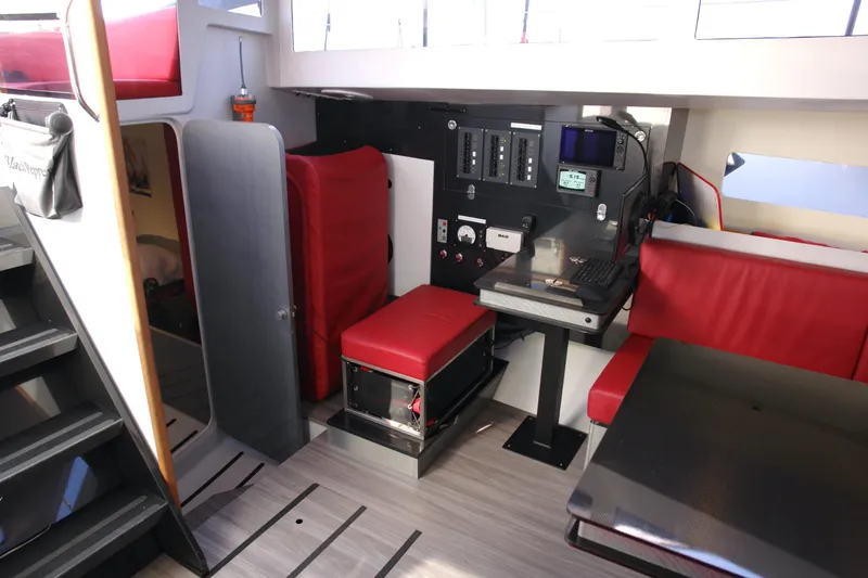 Slide: The Image of Modern yacht interior with red seating, navigation equipment, and sleek design. Black Pepper Code 2, 2025 model. - 15