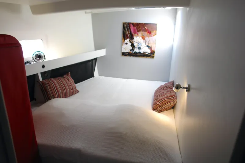 Slide: The Image of Cozy bedroom with modern decor, striped pillows, and abstract wall art in Black Pepper Code 2, 2025. - 16