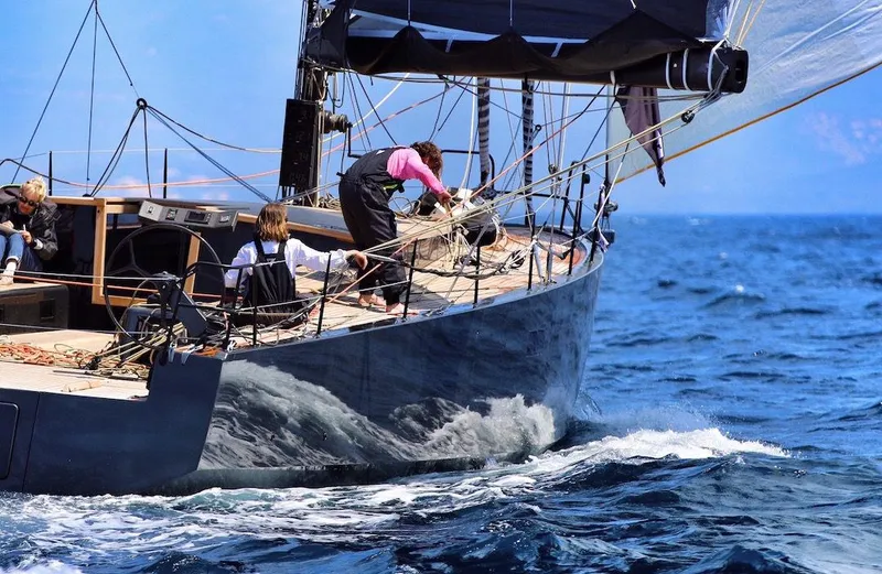 Slide: The Image of Sailing yacht "Black Pepper Code 2" navigating ocean waves, 2025 model. - 3