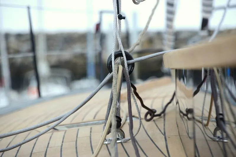 Slide: The Image of Close-up of Black Pepper Code 2 sailboat rigging, 2025 model, showcasing detailed deck lines. - 8