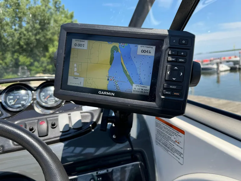 Slide: The Image of Garmin GPS on 2006 Yamaha AR 210 boat dashboard, displaying navigation map near marina. - 11