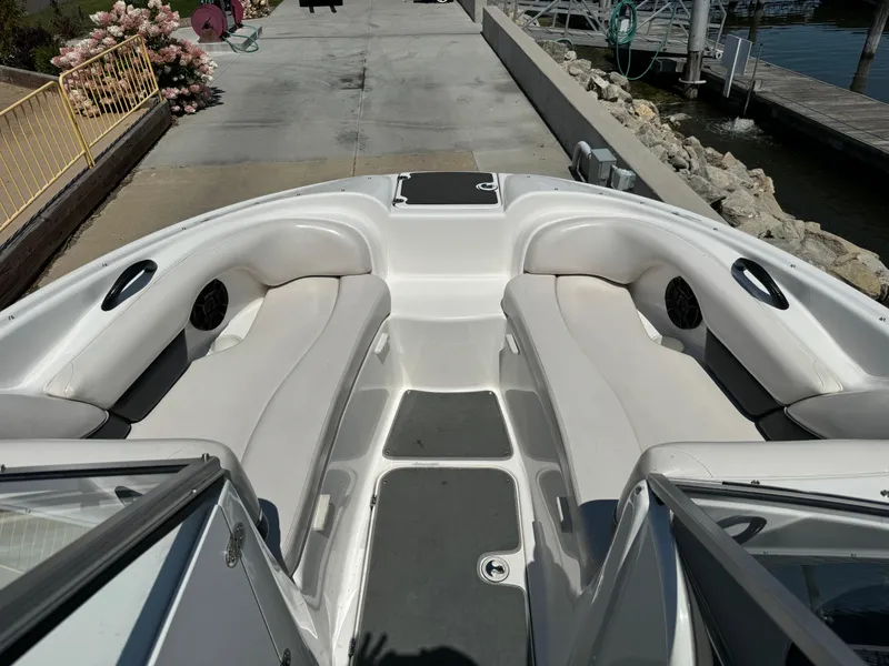 Slide: The Image of 2006 Yamaha Boats AR 210 interior with white seating and open bow design. - 14