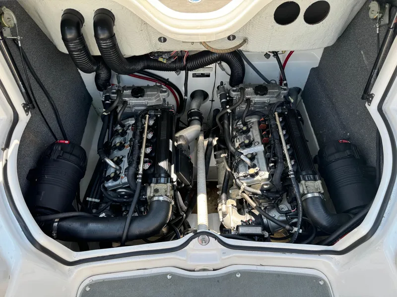 Slide: The Image of Twin engines of a 2006 Yamaha Boats AR 210, showcasing detailed mechanical components. - 22