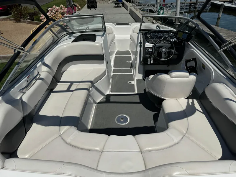 Slide: The Image of 2006 Yamaha Boats AR 210 interior with spacious seating and modern dashboard. - 24