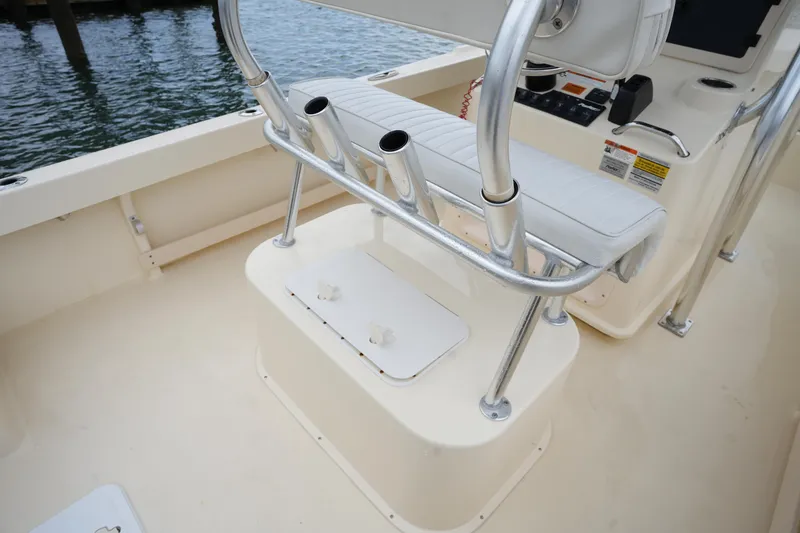 Slide: The Image of 2012 Parker 21 SE CC boat interior with seating and rod holders. - 14