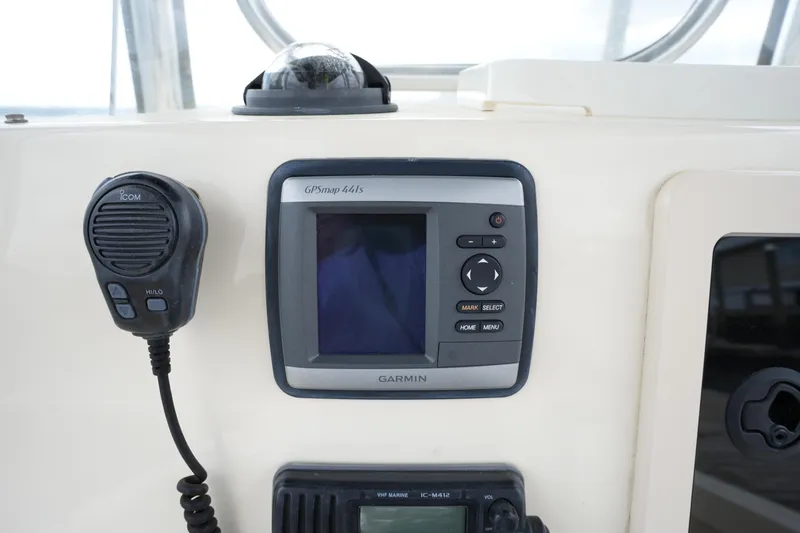 Slide: The Image of Control panel of a 2012 Parker 21 SE CC boat with Garmin GPS and radio. - 21