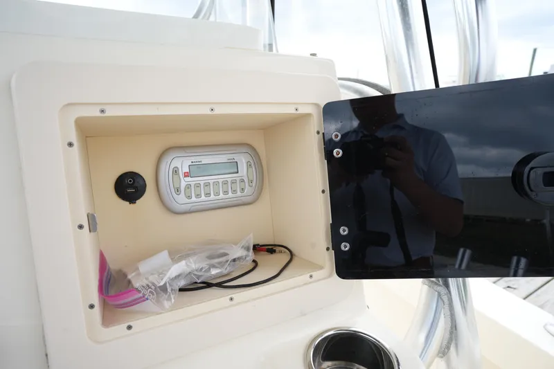 Slide: The Image of Control panel of a 2012 Parker 21 SE CC boat with electronic display. - 23