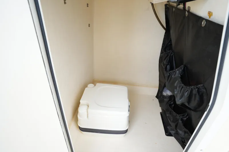 Slide: The Image of Compact boat storage area with portable toilet, Parker 21 SE CC, 2012 model. - 24