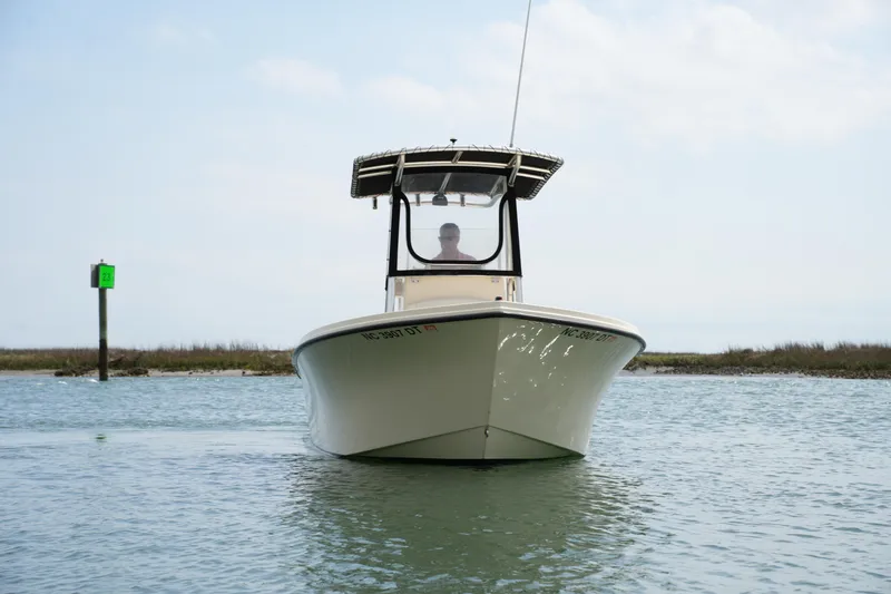 Slide: The Image of 2012 Parker 21 SE CC boat on calm water, front view. - 3