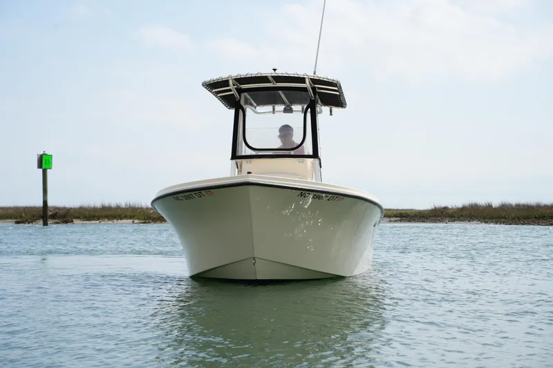 Slide: The Image of 2012 Parker 21 SE CC boat on calm water, front view. - 4