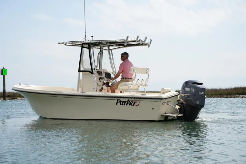 Slide: The Image of 2012 Parker 21 SE CC boat with Yamaha engine on calm water. - 7