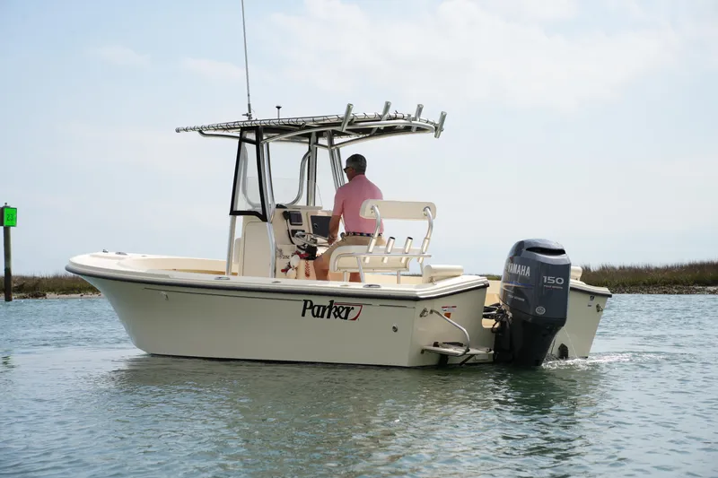 Slide: The Image of Parker 21 SE CC boat from 2012 on water, featuring Yamaha 150 outboard motor. - 8