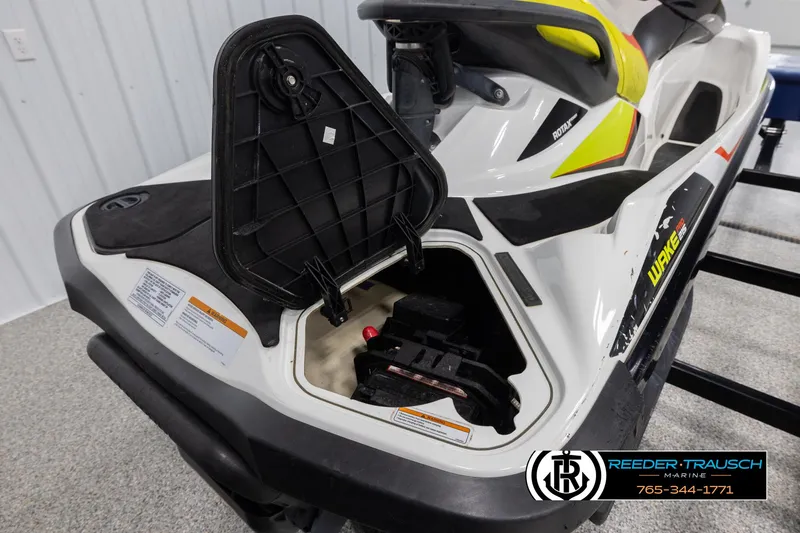 Slide: The Image of 2015 Sea-Doo 215 WAKE PRO with open storage compartment, showcasing interior details. - 12