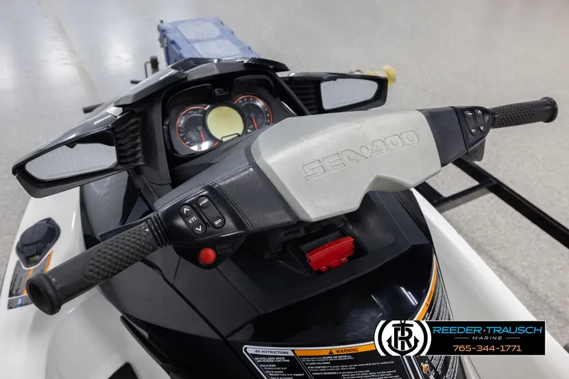 Slide: The Image of 2015 Sea-Doo 215 WAKE PRO dashboard and handlebars, featuring control buttons and gauges. - 13