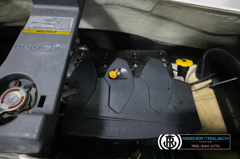 Slide: The Image of Engine compartment of a 2015 Sea-Doo 215 WAKE PRO with visible components and branding. - 20