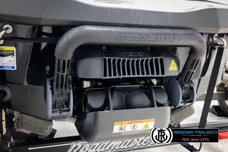 Slide: The Image of 2015 Sea-Doo 215 WAKE PRO engine close-up on trailer, showcasing mechanical details. - 21