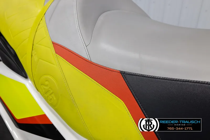 Slide: The Image of 2015 Sea-Doo 215 WAKE PRO seat with vibrant yellow, red, and gray design. - 24