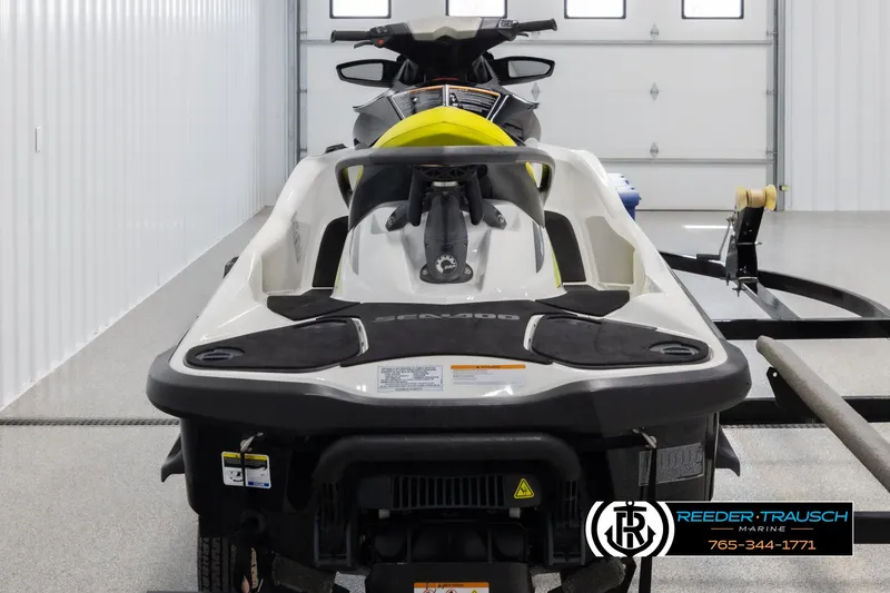 Slide: The Image of 2015 Sea-Doo 215 WAKE PRO jet ski in a garage setting. - 6