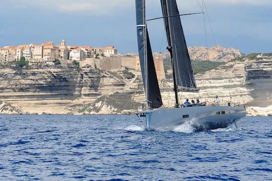 Slide: The Image of Sleek Black Pepper Code 3 yacht sailing near rocky coastline, 2025 model. - 13
