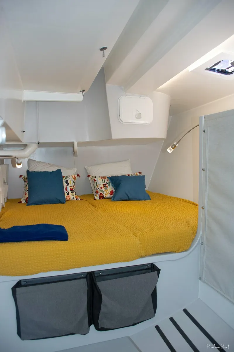 Slide: The Image of Cozy cabin interior of 2025 Black Pepper Code 3 with vibrant bedding and modern design. - 23