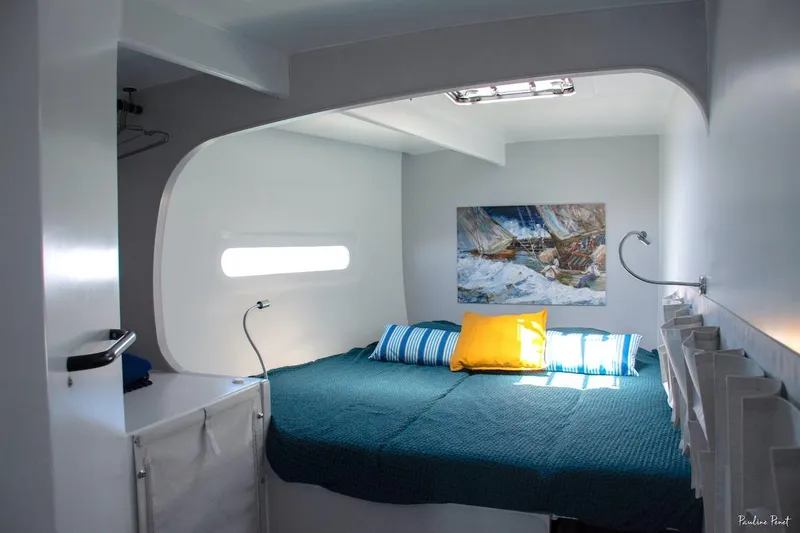 Slide: The Image of Cozy cabin interior with modern design, featuring a bed and nautical decor, in Black Pepper Code 3 yacht. - 24