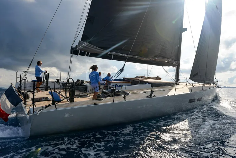 Slide: The Image of Sleek Black Pepper Code 3 yacht sailing on open water, 2025 model. - 4