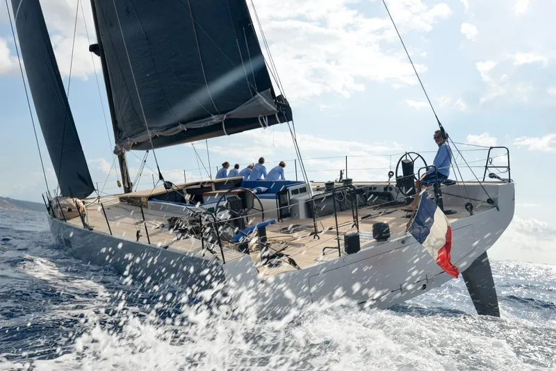 Slide: The Image of Sailing yacht Black Pepper Code 3, 2025 model, navigating ocean waves with crew on deck. - 7