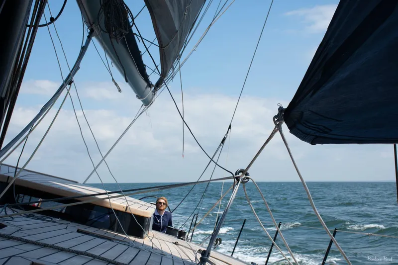 Slide: The Image of Sailing on Black Pepper Code 3 yacht, 2025 model, with ocean view and clear skies. - 8