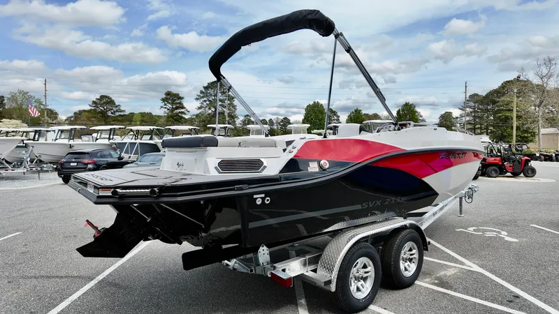 Slide: The Image of 2025 Starcraft SVX 211 IO boat on trailer in parking lot. - 5