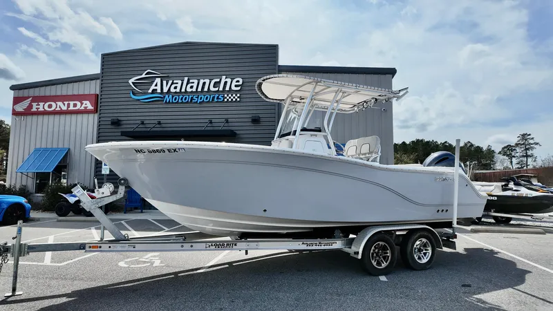 Slide: The Image of 2022 Sea Fox 228 Commander boat on trailer at Avalanche Motorsports dealership. - 1
