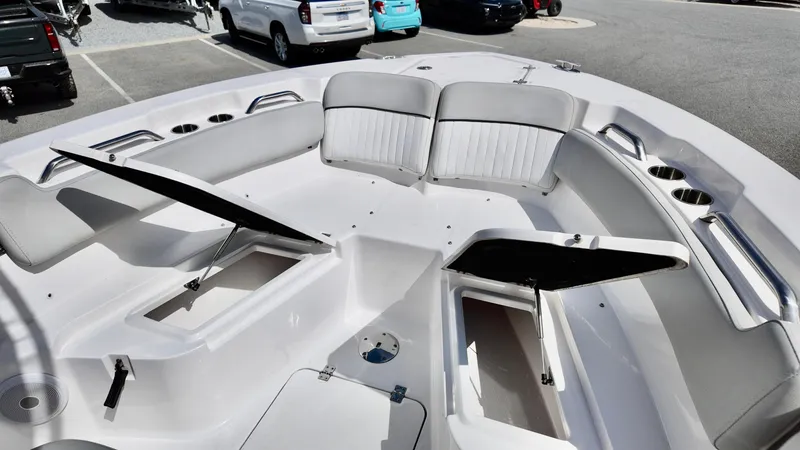 Slide: The Image of 2022 Sea Fox 228 Commander boat interior with open storage compartments and seating. - 11