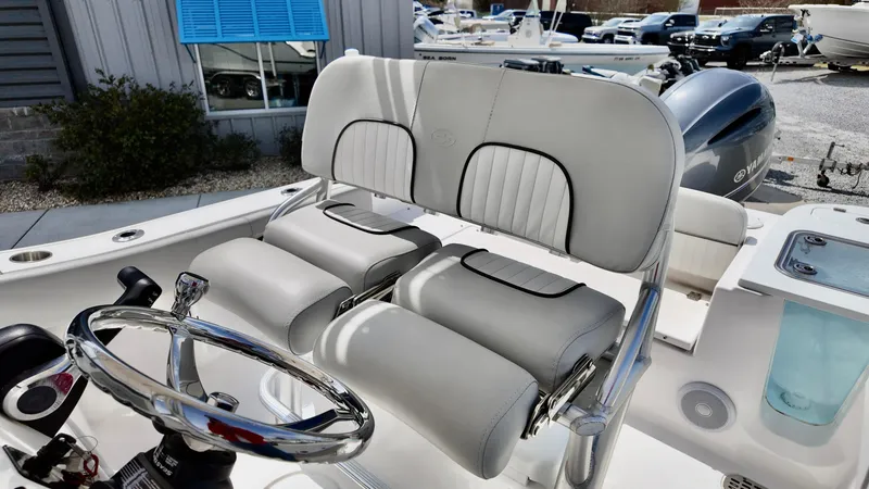 Slide: The Image of 2022 Sea Fox 228 Commander boat interior with dual seats and steering wheel. - 12