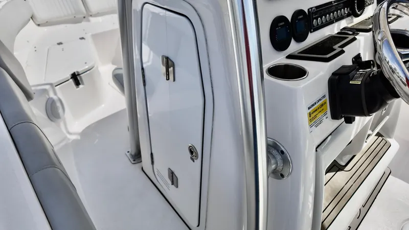 Slide: The Image of 2022 Sea Fox 228 Commander boat interior with control panel and seating. - 13