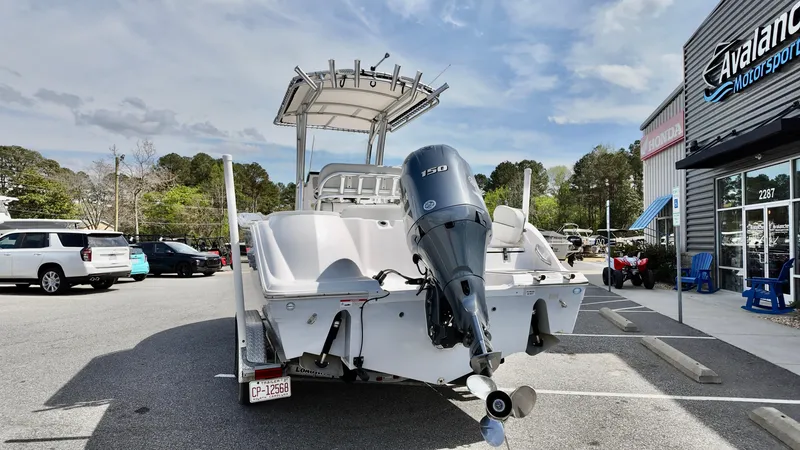 Slide: The Image of 2022 Sea Fox 228 Commander boat with outboard motor in a parking lot. - 4