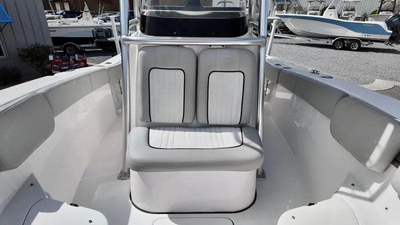 Slide: The Image of 2022 Sea Fox 228 Commander boat interior with cushioned seating and sleek design. - 6