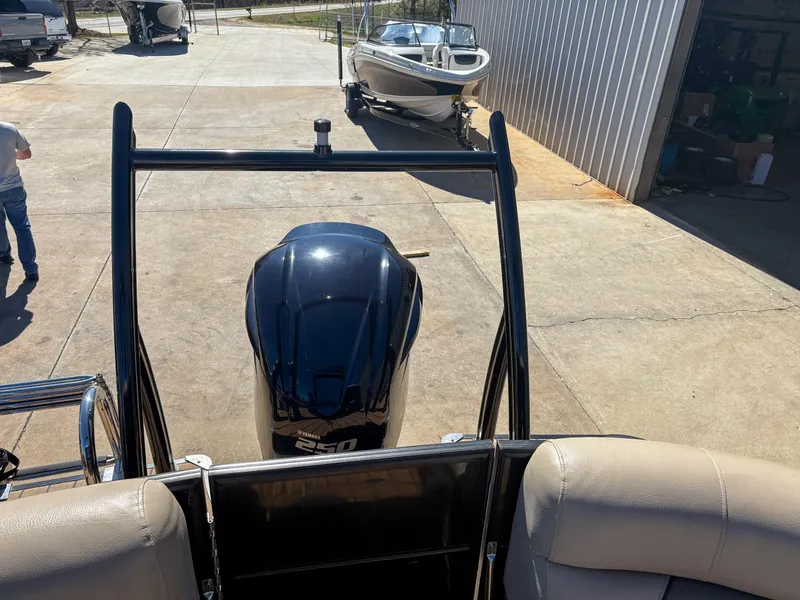Slide: The Image of 2019 Trifecta 25 RF SS 3.0+ boat with powerful outboard motor in a marina. - 10