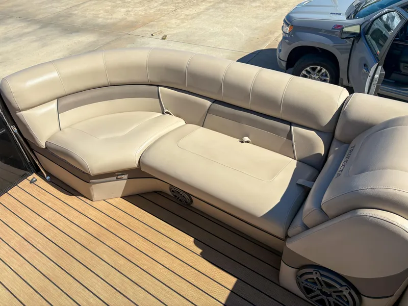 Slide: The Image of Luxurious seating on 2019 Trifecta 25 RF SS 3.0+ pontoon boat, beige upholstery, wooden deck. - 13