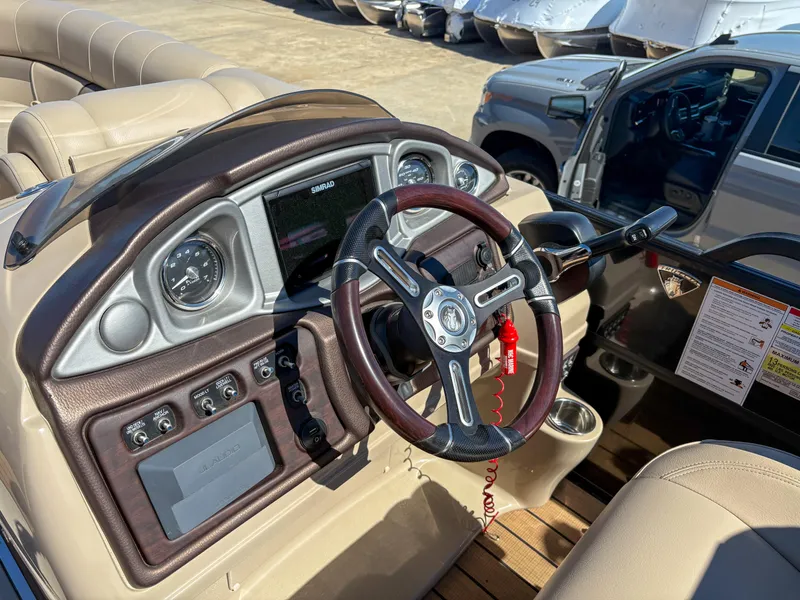Slide: The Image of 2019 Trifecta 25 RF SS 3.0+ boat dashboard with steering wheel and controls. - 17
