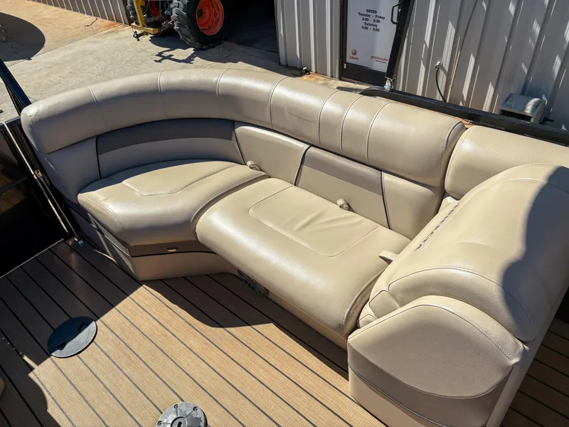 Slide: The Image of Luxurious seating on 2019 Trifecta 25 RF SS 3.0+ pontoon boat, featuring beige upholstery. - 2