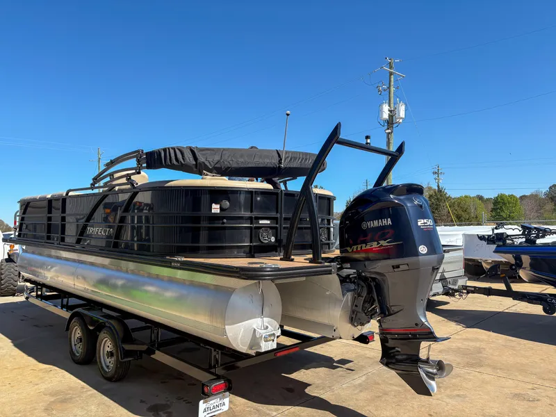 Slide: The Image of 2019 Trifecta 25 RF SS 3.0+ pontoon boat with Yamaha engine on trailer. - 3