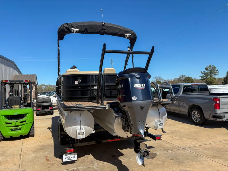 Slide: The Image of 2019 Trifecta 25 RF SS 3.0+ pontoon boat with Yamaha 250 engine, parked outdoors. - 6