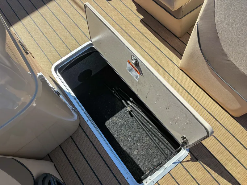 Slide: The Image of Open storage compartment on 2019 Trifecta 25 RF SS 3.0+ boat deck. - 8