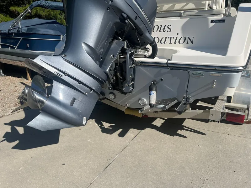 Slide: The Image of 2018 Century 2301 Center Console boat with powerful outboard motor on trailer. - 12