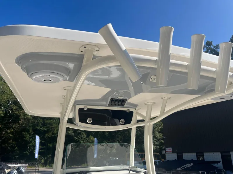 Slide: The Image of 2018 Century 2301 Center Console boat with T-top and rod holders. - 3