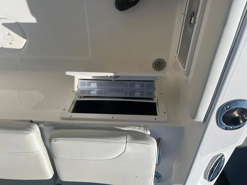Slide: The Image of 2018 Century 2301 Center Console boat interior with open storage compartment. - 8