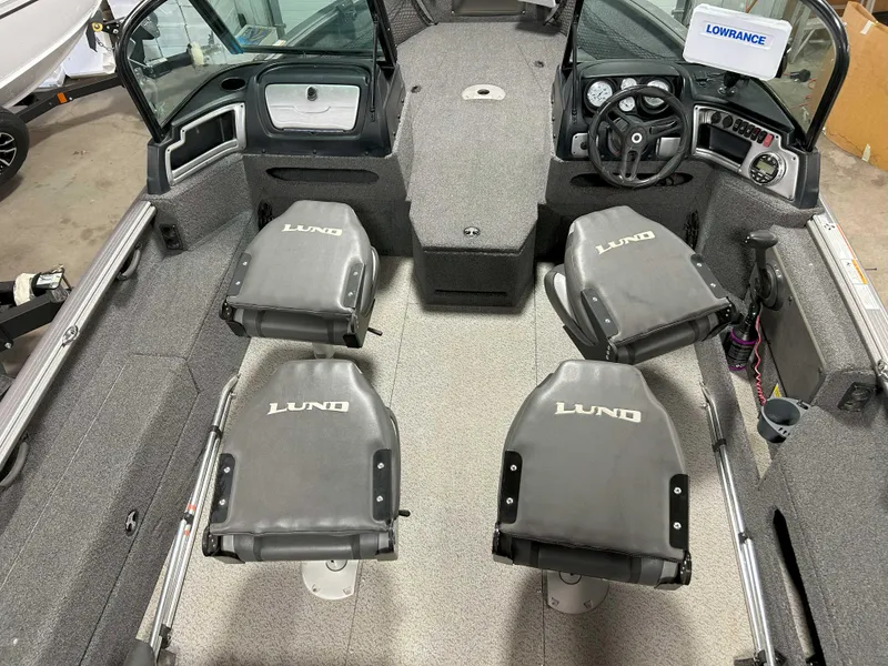 Slide: The Image of 2021 Lund 1875 Impact XS boat interior with four seats and steering console. - 10