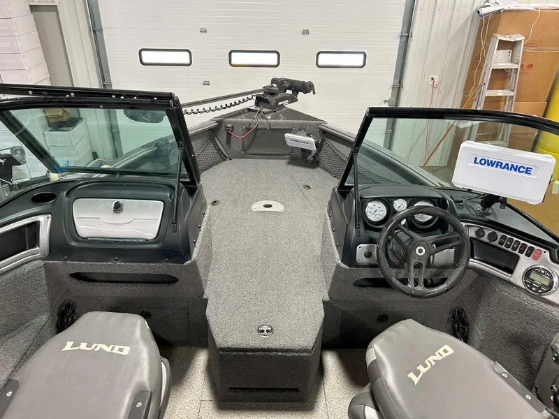 Slide: The Image of 2021 Lund 1875 Impact XS boat interior with Lowrance system and dual seating. - 6