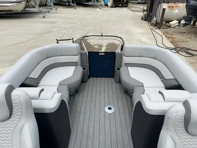 Slide: The Image of 2024 Godfrey Monaco 235 SB pontoon boat interior with gray seating and flooring. - 10